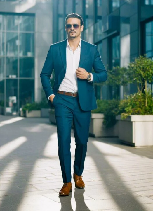 Ahmed Afridi standing outside a glass-fronted building
