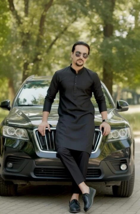 Ahmed Afridi beside a vehicle under trees